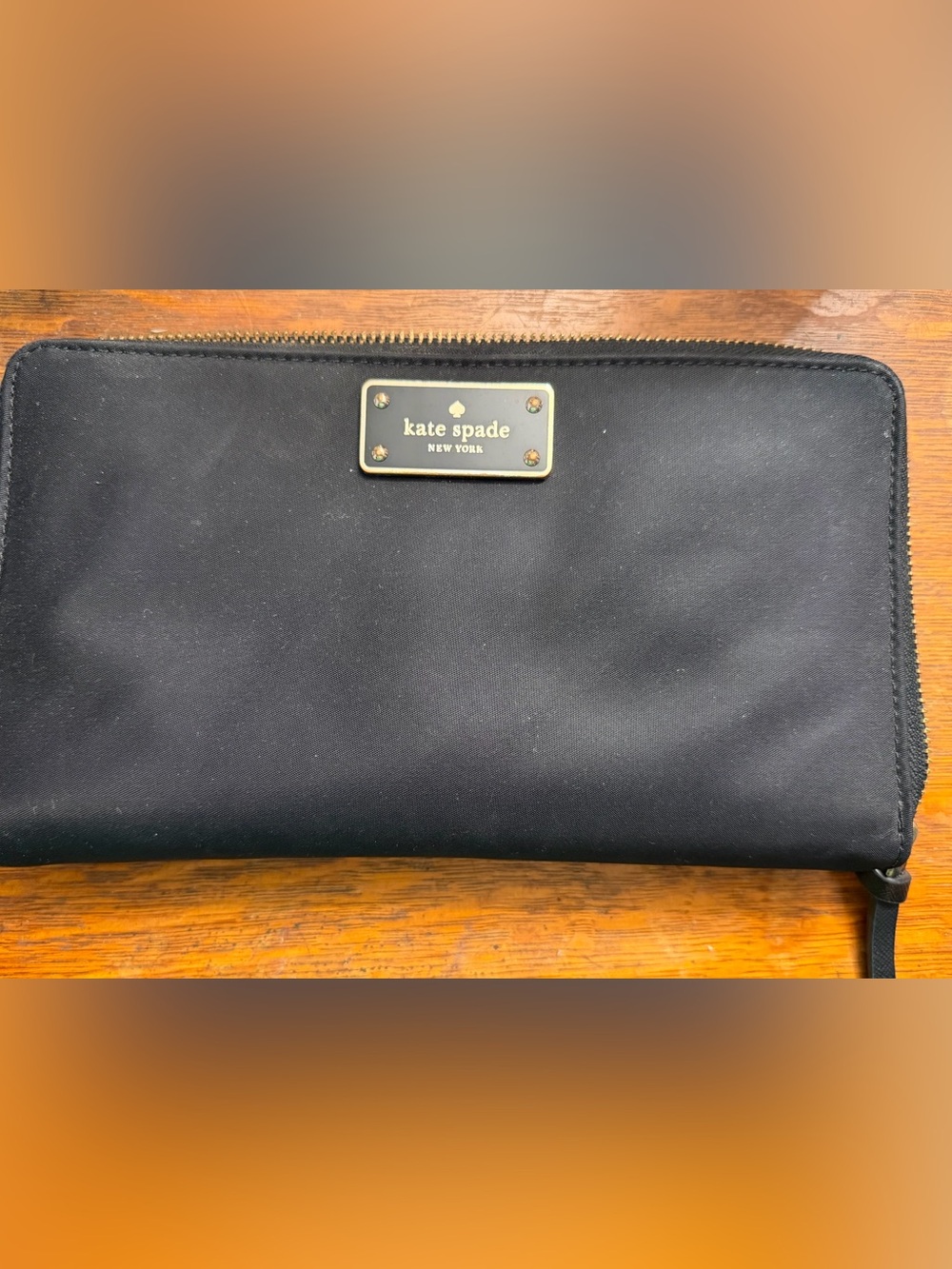 kate spade Black Zip-Around Wallet with Gold Logo Plaque